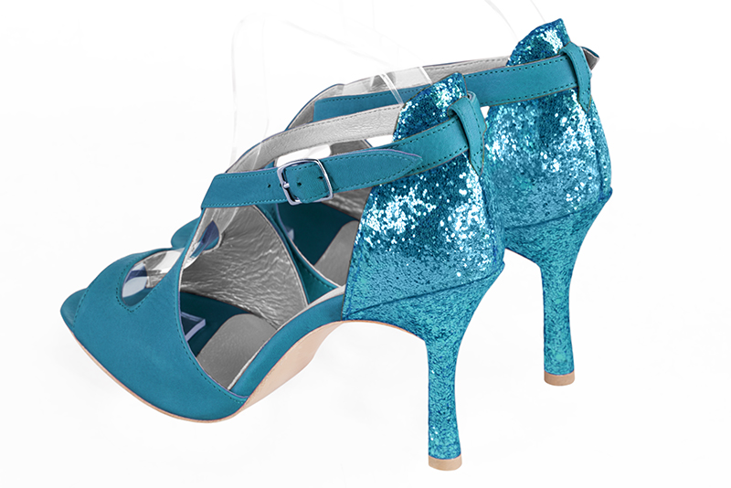 Turquoise blue women's closed back sandals, with crossed straps. Round toe. Very high slim heel. Rear view - Florence KOOIJMAN